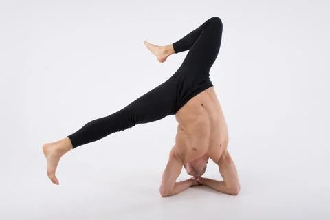 A cool stretch from an attractive athletic guy. 스톡 사진