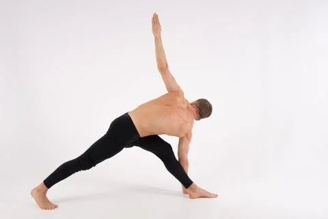 A cool stretch from an attractive athletic guy. Stock Photos
