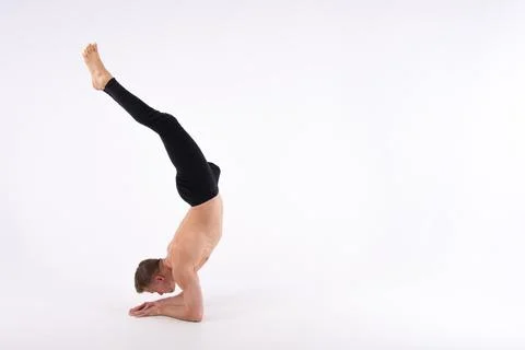 A cool stretch from an attractive athletic guy. Stock Photos