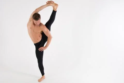 A cool stretch from an attractive athletic guy. Stock Photos