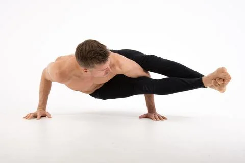 A cool stretch from an attractive athletic guy. Stock Photos