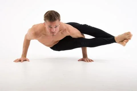 A cool stretch from an attractive athletic guy. Stock Photos