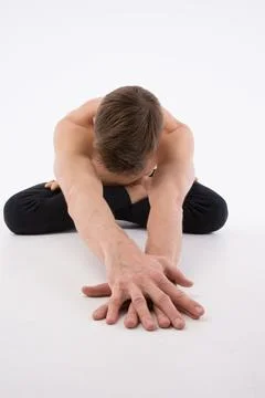 A cool stretch from an attractive athletic guy. Stock Photos