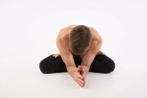 A cool stretch from an attractive athletic guy. Stock Photos