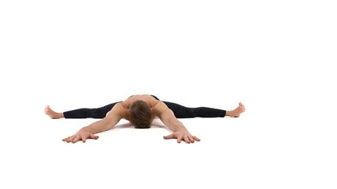 A cool stretch from an attractive athletic guy. Stock Photos