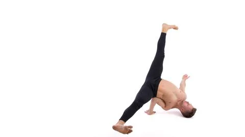 A cool stretch from an attractive athletic guy. Stock Photos