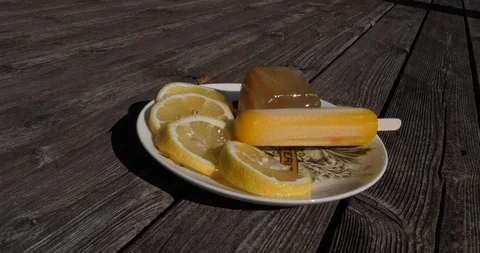 Cool summer Iced Tea Popsicles and Cubes with lemons. Several angles Stock Footage 100005913