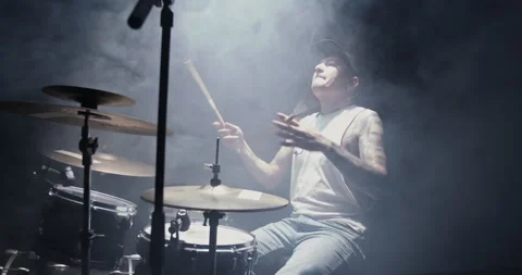 Cool tattooed man playing drums on stage in club Stock Footage 249852632