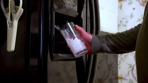 Cool water drink, ice dispenser operation, modern kitchen appliances Stock Footage 306232441