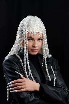Cool woman with a wig of pearls and make up Stock Photos