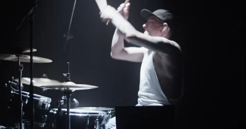 Cool young drummer practicing beats on cymbals on stage Stock Footage 249852914