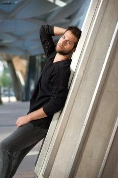 Cool young man with beard posing outdoors Stock Photos