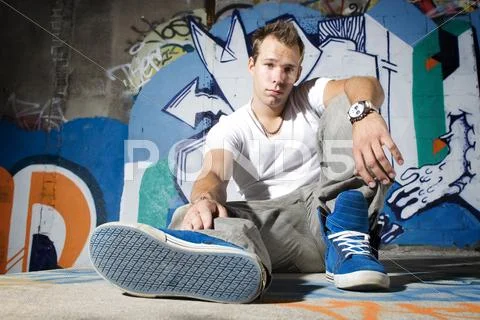 Cool young man showing off shoes Stock Photos
