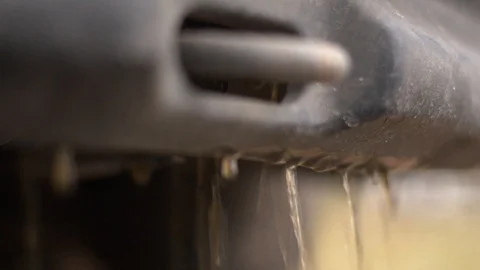 Coolant flows down the car bumper to the ground. Stock Footage 120670557