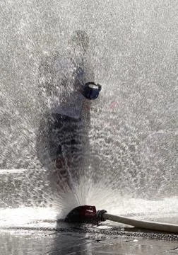 Cooling and having fun under water sprayer Foto stock