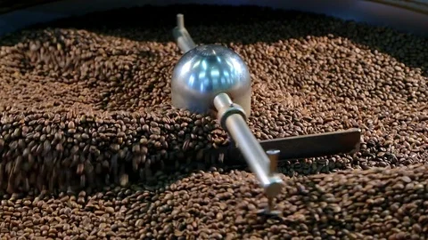 Cooling coffee beans after roasting. Roasting machine. Slow-motion. Stock Footage 72707567