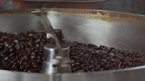 Cooling coffee beans after roasting. Roasting machine, close-up Mixing roasted 스톡 동영상 334643542
