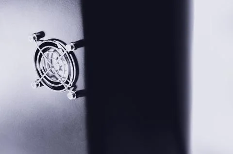 Cooling CPU cooler on a dark casing. Cooling fans are illuminated Stock Photos