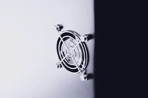 Cooling CPU cooler on a dark casing. Cooling fans are illuminated Stock Photos