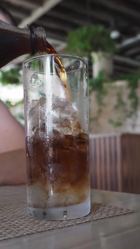 Cooling Down with an Ice-Cold Refreshing Drink Stock Footage 281431039