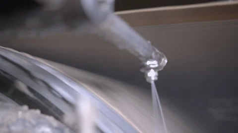 Cooling machine processes paper material surface in workshop Stock Footage 303103996
