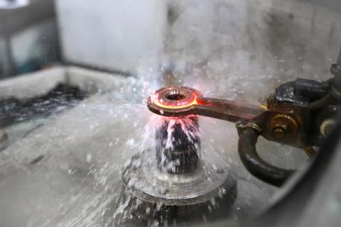 Cooling of metal part with liquid. Technological process Stock Photos
