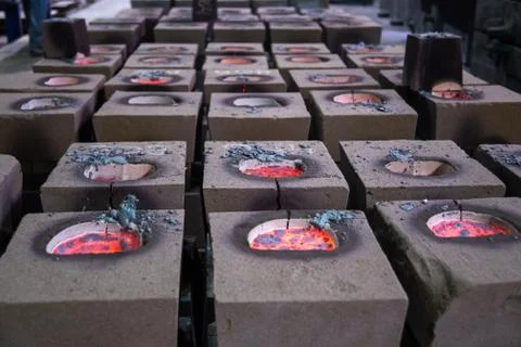 Cooling process of filled sand molds after steel casting, cracked during the Stock Photos