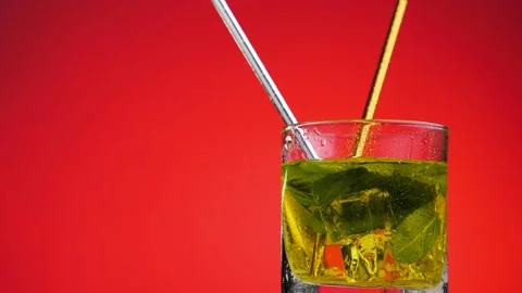 Cooling summer drink rotate on a red background. Stock Footage 131228859