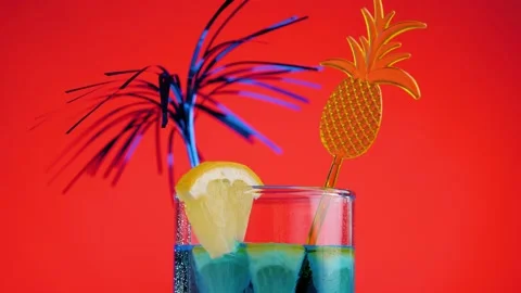 Cooling summer drink rotate on a red background. Fresh citrus cocktail Stock Footage 131947624