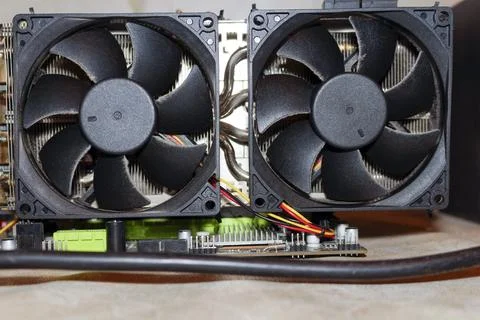 Cooling system of two graphics cards on a wooden table Stock Photos