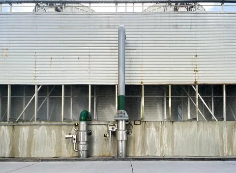 A cooling tower is a device for cooling a large amount of water Stock Photos