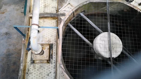 The cooling tower fan for the centrifugal chiller system in the building. Stock Footage