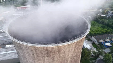 Cooling tower releasing steam in a thermal power plant Stock Footage 337909686
