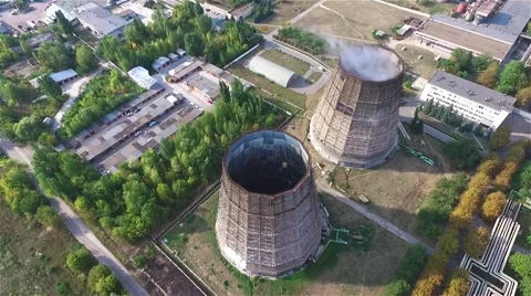 Cooling tower thermal power station HD aerial video. Urban industrial area Stock Footage 68583446