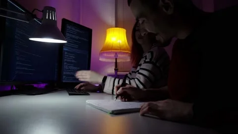 Cooperation of two IT workers who are coding new program on computer Stock Footage 152721548
