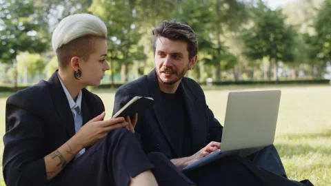 Cooperation two perspective man and girl browsing gadgets wear suits. Users Stock Footage 252880674