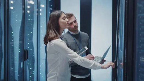 Cooperative team of server engineers doing important data management with open 스톡 동영상 125519418