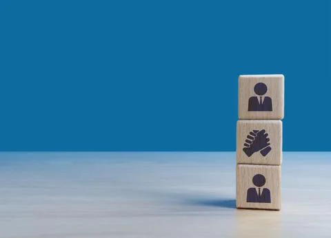 Coordinate, join forces in business, two businessmen join hands Stock Photos