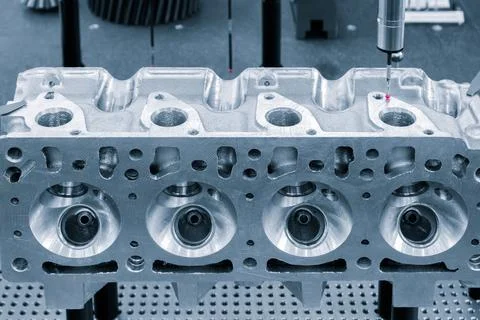 Coordinate measuring machine probe measure cylinder block of diesel engine re Stock Photos