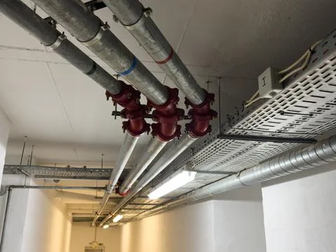 Coordinated overhead distribution piping system for cold water and natural .. Stock Photos