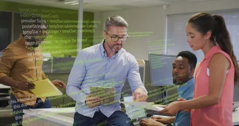 Coordinator handing reports while team reviewing tablet with animated code Stockbeeldmateriaal 317486998