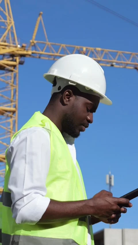 Coordinator Monitors Project. Project Leader Oversees Schedule And Safety At 스톡 동영상 334611457