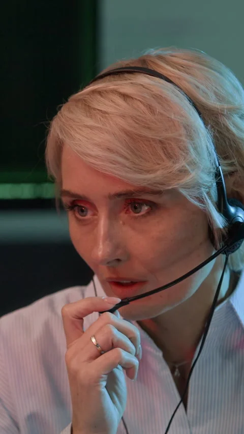 Coordinator Reporting Data via Headset in Cybersecurity Office, Vertical Stock Footage 334929572