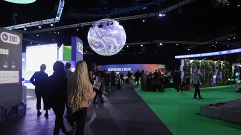 COP 26 main hall with crowds and large globe Stock Footage 167092593