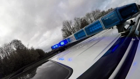 Cop car blue lights flash Stock Footage 98817650
