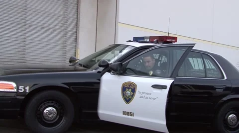 Cop car drives up Fast - close up Video stock 52003014