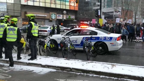 Cop car joining a group of cops cyclist Stock Footage 87751969