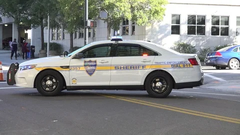 Cop car in street Stock Footage 128446722