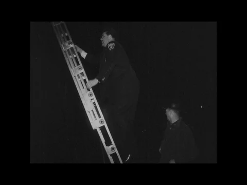 Cop Climbs Ladder Climbing Building to Roof Fire Department Stock Footage 77625701