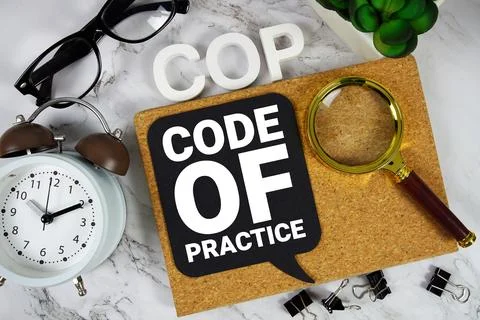 COP Code Of Practice text with alarm clock and magnifying glass on marble b.. Stockfoto's